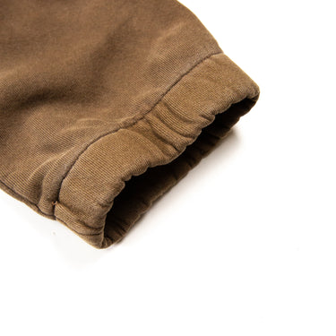 Flat lay showing the cuff of Joah Brown brown sweatpants, in brown.