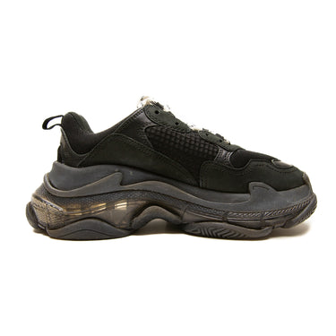 The left of the Balenciaga Black Triple S Trainers.