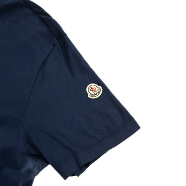 The arm logo of the Moncler Navy & Beige Polo Shirt.