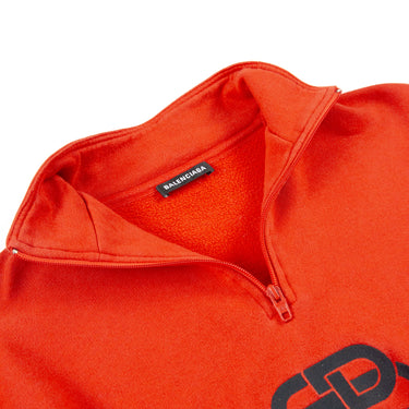 The inside label of the Balenciaga Red Rive Gauci 1/4 Zip sweatshirt.
