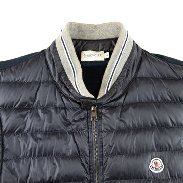 The front logo of the Moncler Navy Magllia Gilet.
