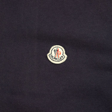The logo of the Moncler Cotton Zip-Up Navy Sweatshirt.