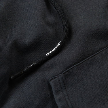 Close-up detail of Off-White logo on the Dark Grey Hand Print Hoodie in black.
