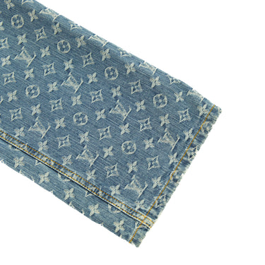 The leg of the Louis Vuitton Monogram Denim Jeans.