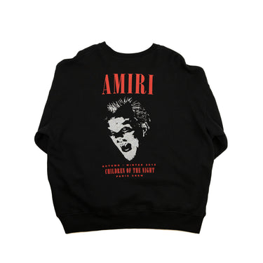 The back of the Amiri Black A/W18 Children of the Night Vampire Sweatshirt showing a large vampire graphic logo with a glittery effect.