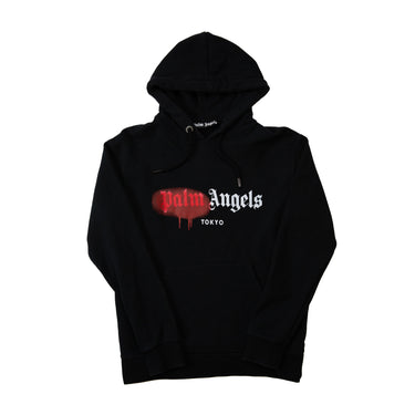 The front of the Palm Angels Spray Logo Black Hoodie.