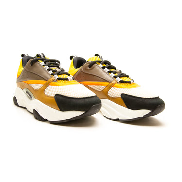 The front of the Dior B22 Ebony Camel Yellow Calfskin Trainer.