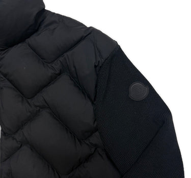 The logo of the Moncler Quilted Shell Ribbed Knit Cardigan Jacket.