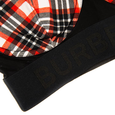The front logo of the Burberry Red Check Bra Top.