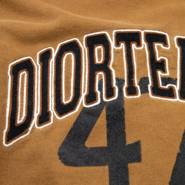 Logo on the front of the Dior x Denim Tears Brown Sweatshirt.