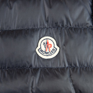 The logo of the Moncler Navy Magllia Gilet.