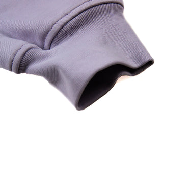 A close-up detail of the cuff of Vivienne Westwood lilac baby-bear sweatpants.