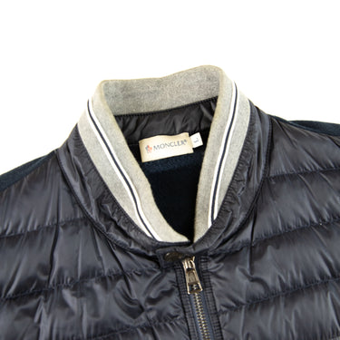 The collar of the Moncler Navy Magllia Gilet.