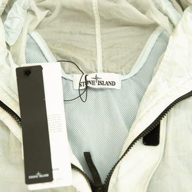 The inside label and tag of the Stone Island Reflective Grid On Lamy-TC Jacket.