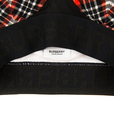The inside label of the Burberry Red Check Bra Top.