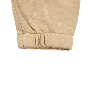The band of Joah Brown LA Sand Sweatpants in a sand beige color.