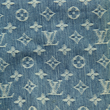 The monogram print of the Louis Vuitton Monogram Denim Jeans.
