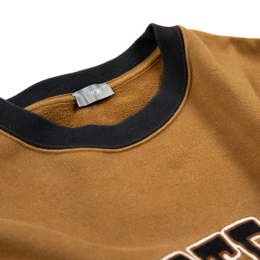 Inside collar with label of the Dior x Denim Tears Brown Sweatshirt.