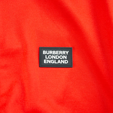 The logo of the Burberry Astala Red Track Jacket.
