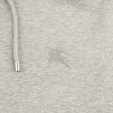 The logo of the Burberry Check Hood Grey Zip Hoodie.