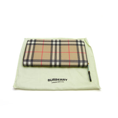 The front and dustbag of the Burberry Check Zip Wallet.