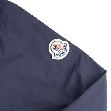 The logo of the Moncler Black Windbreaker.