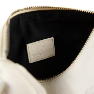 The inside label of the Dior x Daniel Arsham White Leather Roller Bag, illustrating the brand detail.