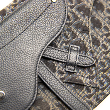 The detail of the Dior Black Oblique Saddle Bag.