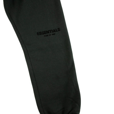 The leg of the Fear Of God ESSENTIALS Stretch Limo Sweatpants.