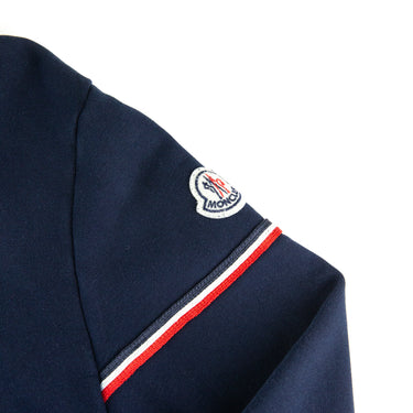 The logo of the Moncler Navy Zip Up Sweatshirt.