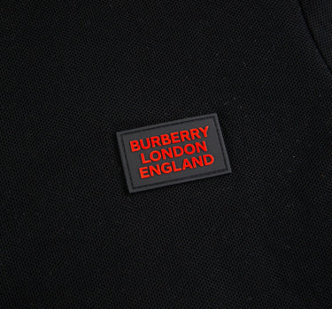 The logo of the Burberry London England Rubber Logo Black Polo Shirt.