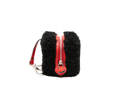 The side view of a Fendi Dice Box Bag in Black & Red.