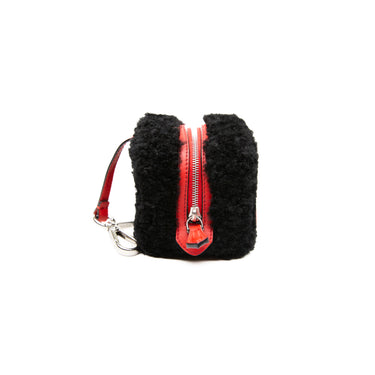 The side view of a Fendi Dice Box Bag in Black & Red.