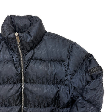 The logo of the Dior Oblique Navy Down Puffer Jacket.