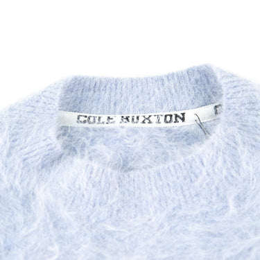 The collar of the Cole Buxton Baby Blue Alpaca Crew Knit Sweat.
