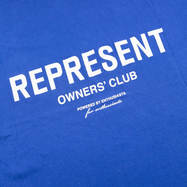 The logo of the Represent Owners Club Blue T Shirt.