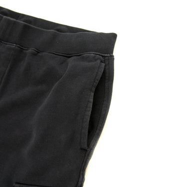 The pocket of the C.P. Company Navy Lens Sweatpants.