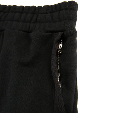 The pocket of the Amiri Black Shorts.