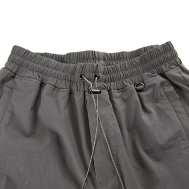 The waistband of the Represent Grey Cargo Trousers.