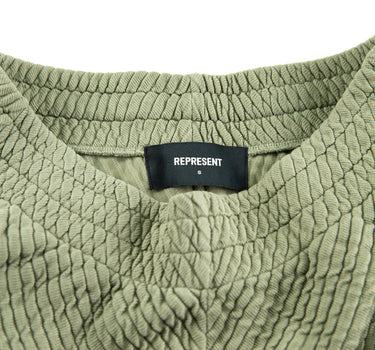 The label of the Represent Ottoman Green Shorts.