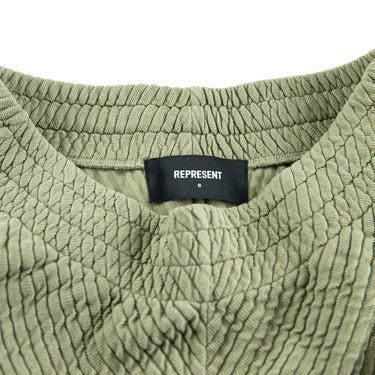 The label of the Represent Ottoman Green Shorts.