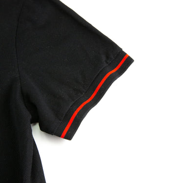 The sleeve of the Burberry London England Rubber Logo Black Polo Shirt.
