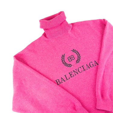 The flat lay of the Balenciaga BB Crest Pink Turtle Neck Sweater.