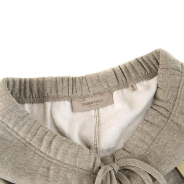 The waistband of the Fear Of God ESSENTIALS Dark Oatmeal Sweatpants S.