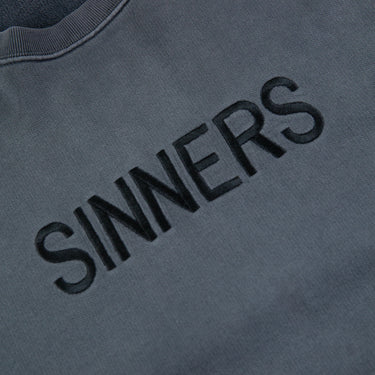 The logo of the Balenciaga Sinners Sweatshirt.