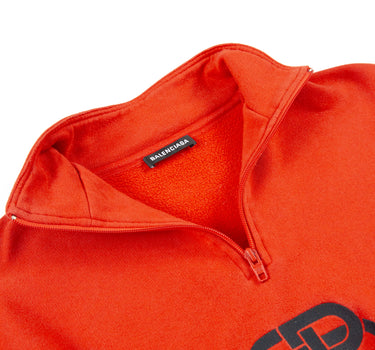 The inside label of the Balenciaga Red Rive Gauci 1/4 Zip sweatshirt.