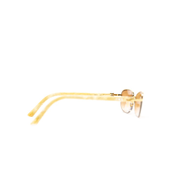 The right of the Cartier 22ct Gold Plated Diamanté Ivory Acetate Rimless Sunglasses.