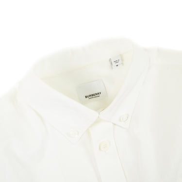 The collar of a Burberry white button-up shirt.
