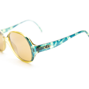 The logo of the Dior 2411 50 Sunglasses.