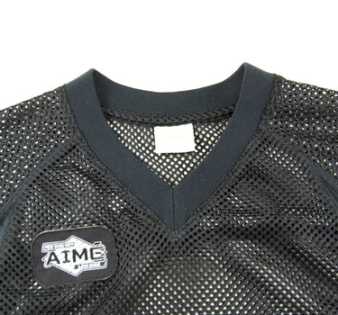 The logo of the Aime Leon Dore Stadium Cropped Practice Black Jersey.